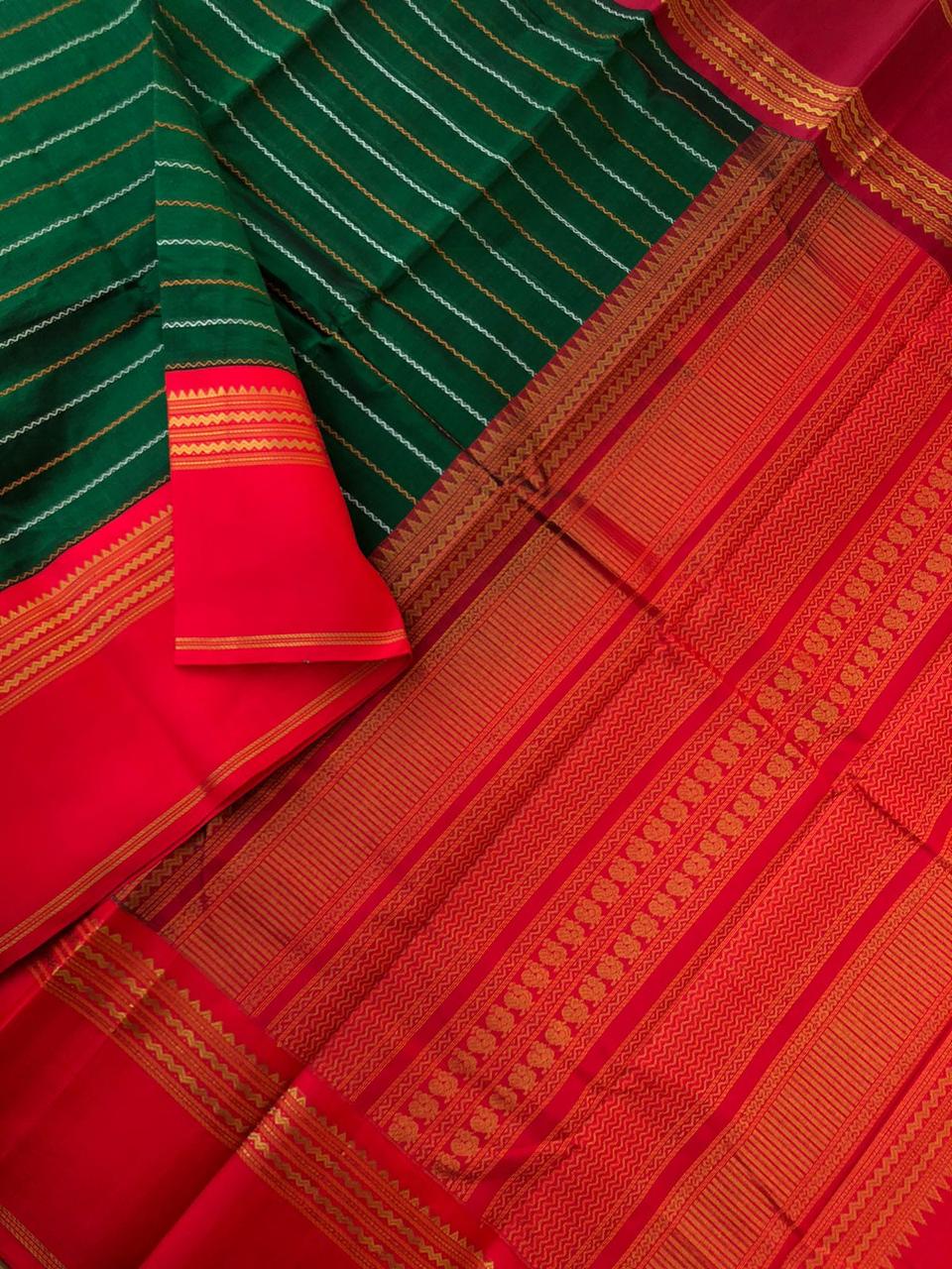 Divyam - Korvai Silk Cotton with Pure Silk Woven Borders - deep dark Meenakshi green veldhari with red and maroon ganga jammuna woven borders