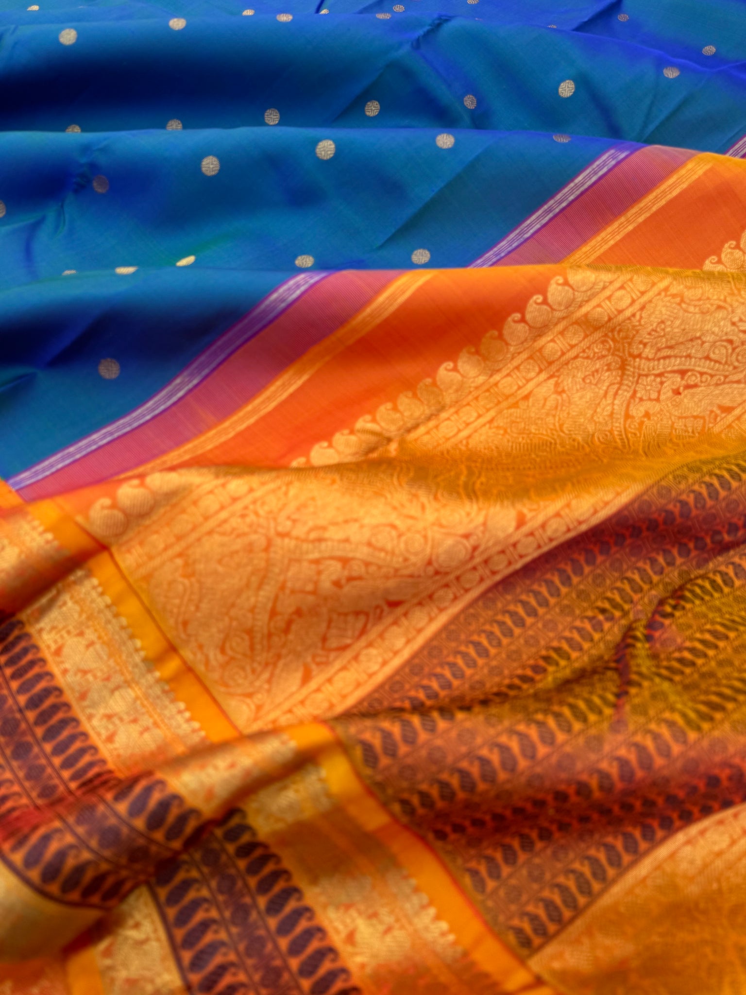 Aarambam - Where Tradition Begins - a classy peacock blue green body with vintage mustard zari and silk thread woven borders and pallu