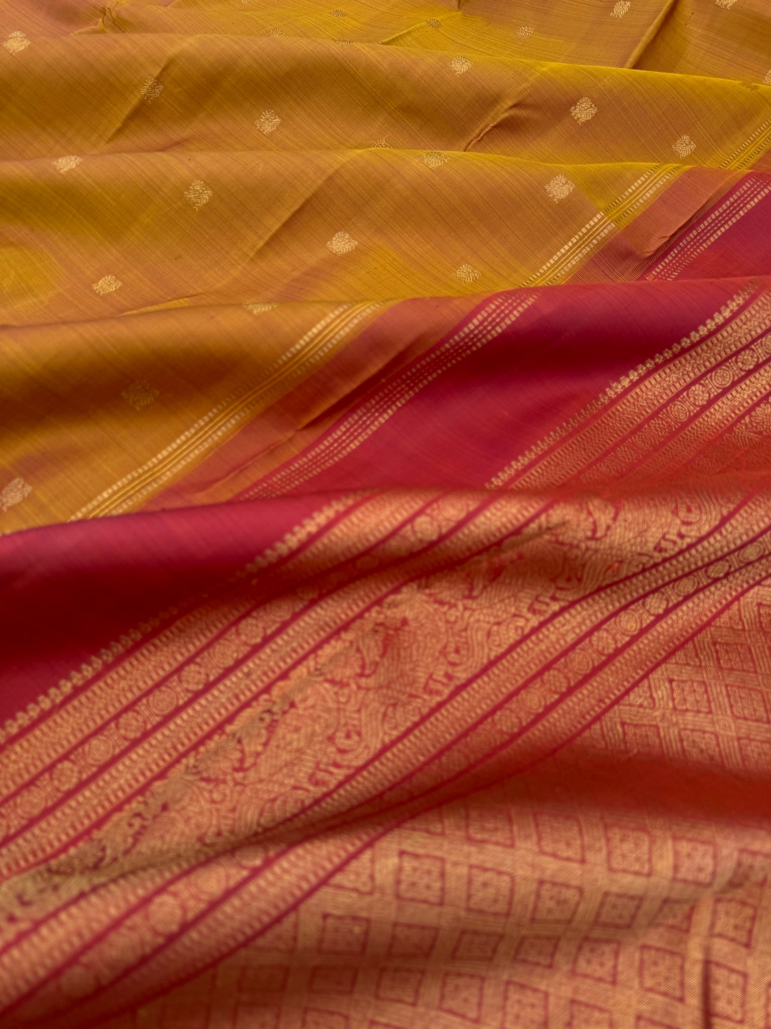 Leela - The bliss of small border Kanchivarams - rust honey and mustard dual tone body with red pallu and buttas woven pallu