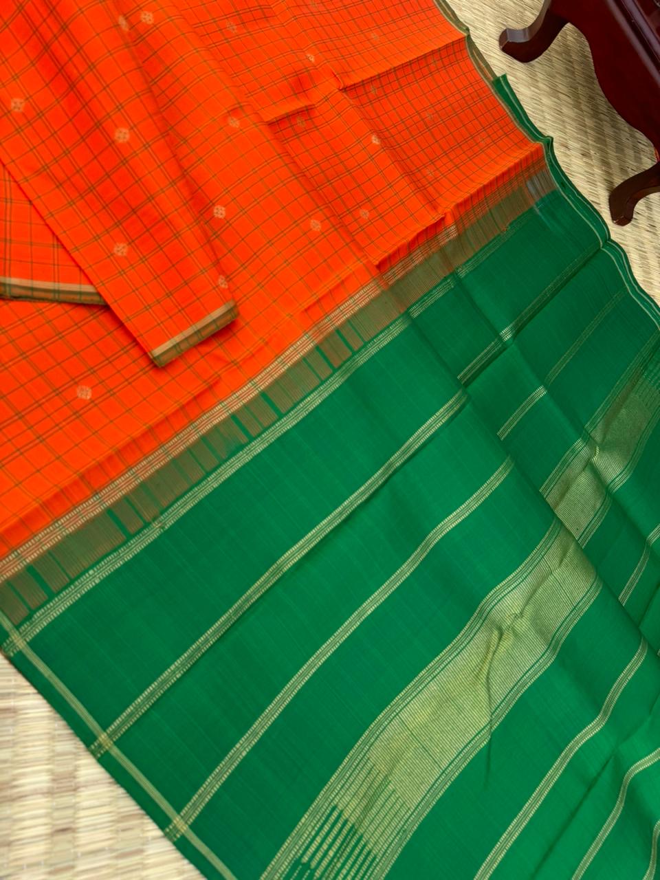 Kanchivaram Trunk - a simple elegant kattam buttas with borderless concept !! In orange and green combination