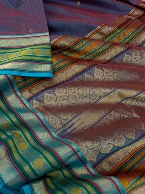 Zari Kissed Silk Cotton - a deep red short blue with laddu Kamalam motifs woven borders