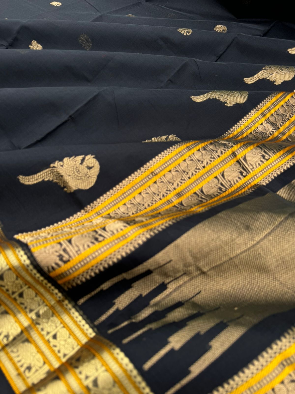 Black Edition of Zari Kissed Silk Cotton - full black and gold with konjum killi woven buttas inbetween the body and pallu