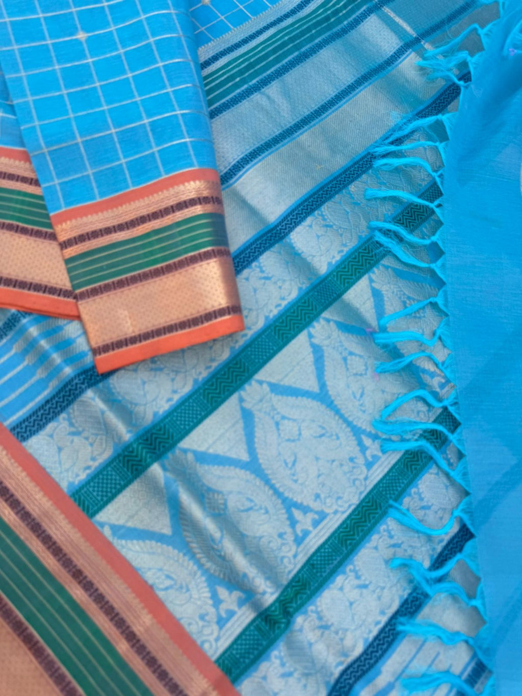 Pastels on Zari Kissed Silk Cotton - a unique powder blue with muthukattam and buttas woven together