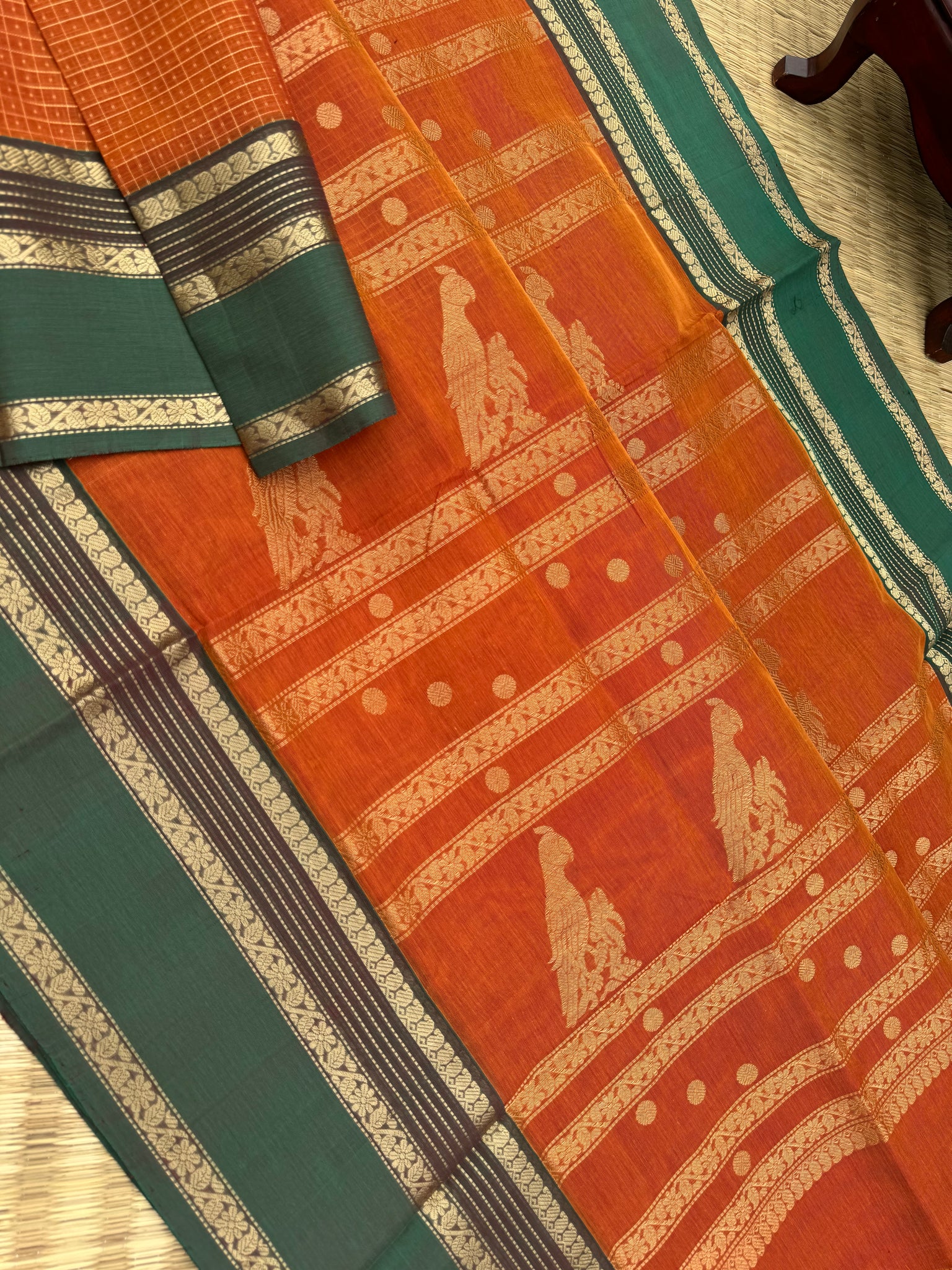 Zari Kissed Silk Cotton - rust orange and short green lakshadeepam with grand long killi woven pallu