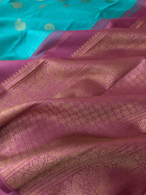 Mohaa - Beautiful Borderless Kanchivarams - turquoise teal oosi Kattam woven body with keva pink pallu and blouse