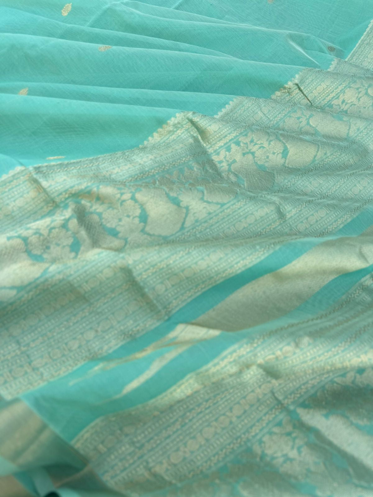 Pastels on Zari Kissed Silk Cotton - a pastel mint green with one inch tissue borders