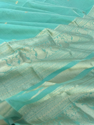 Pastels on Zari Kissed Silk Cotton - a pastel mint green with one inch tissue borders