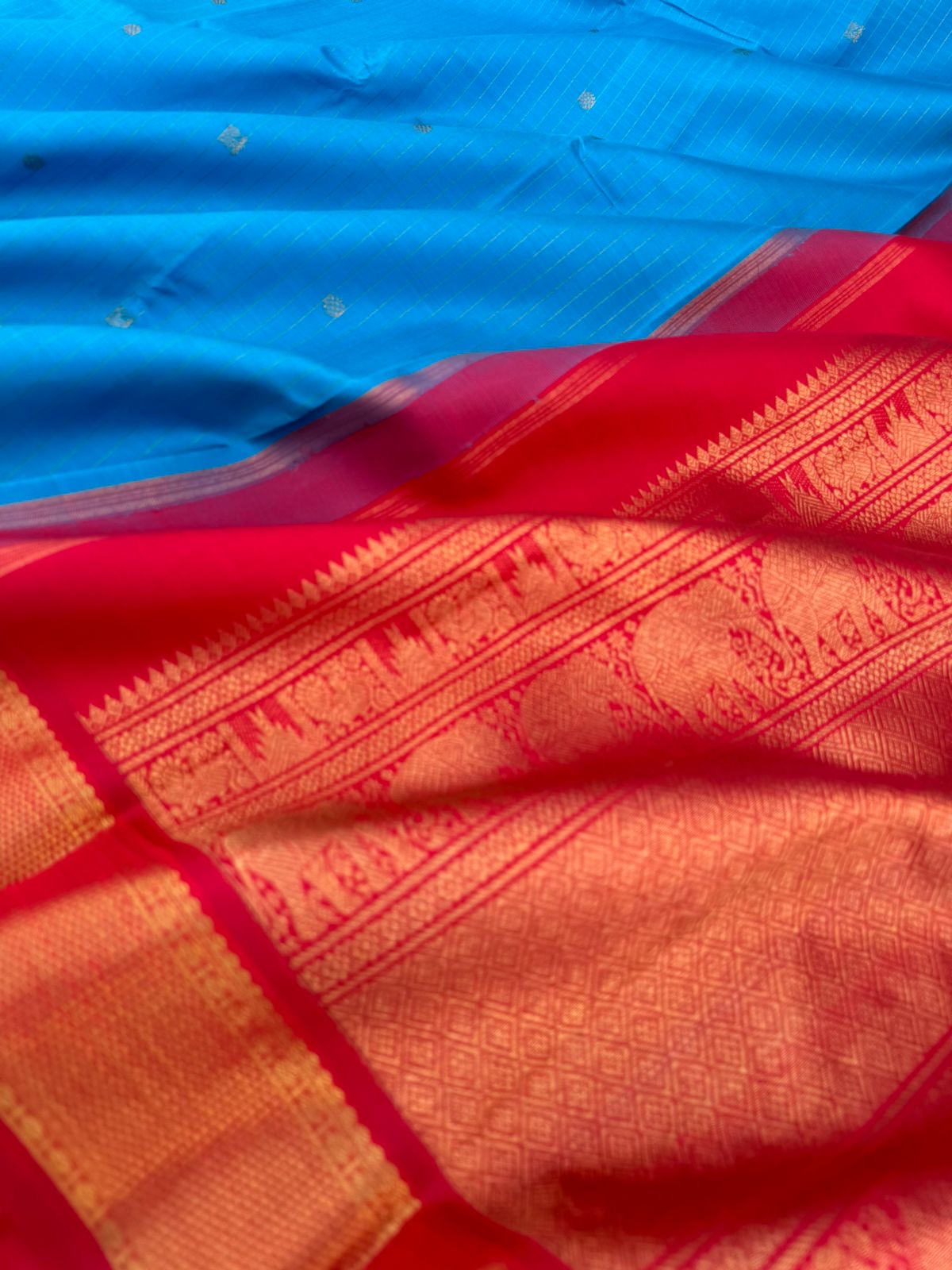 Kanchivaram Trunk - gorgeous Anandha blue and red with vertical zari strips and buttas with aarai maadam woven borders