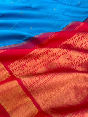Kanchivaram Trunk - gorgeous Anandha blue and red with vertical zari strips and buttas with aarai maadam woven borders