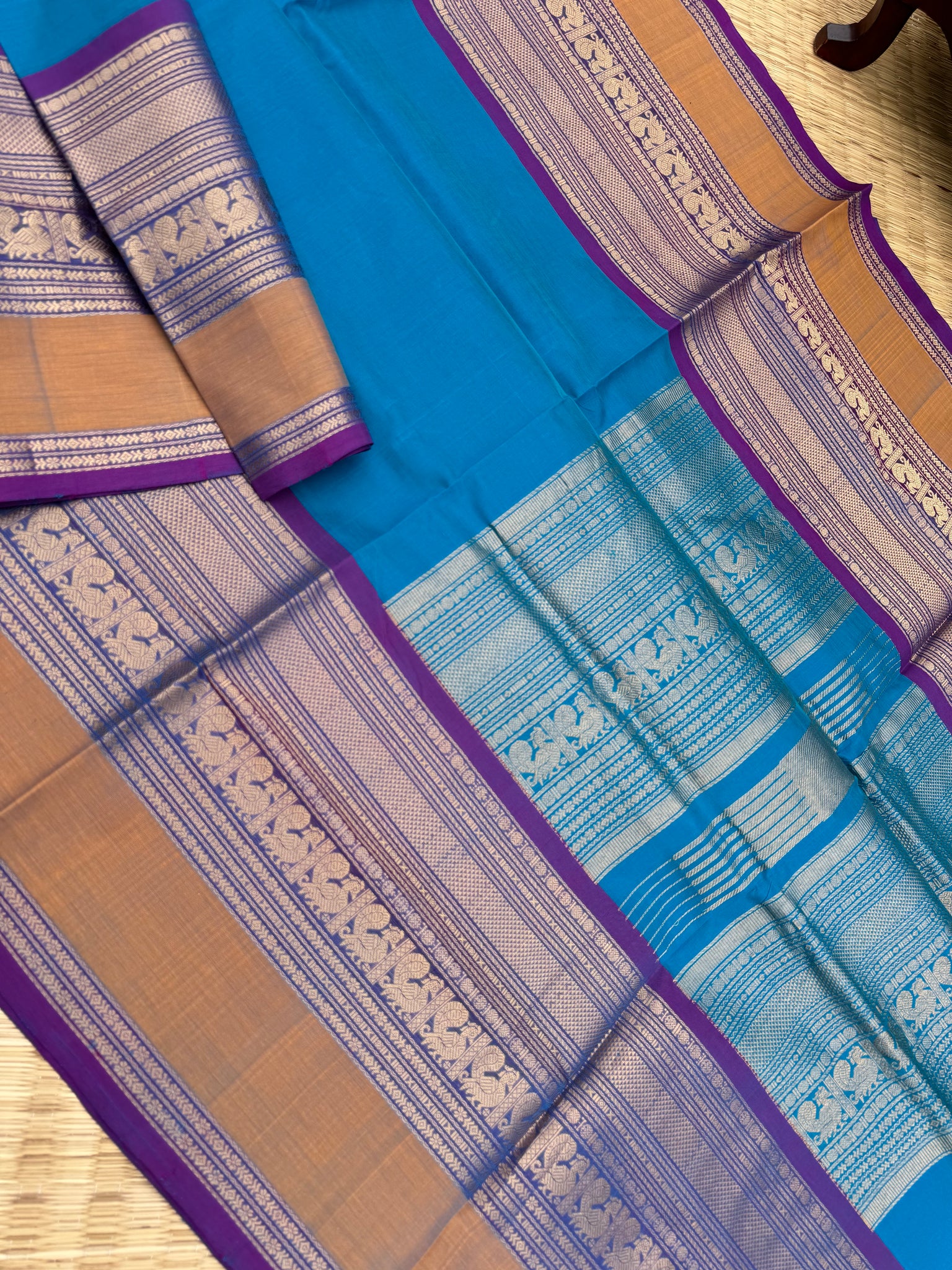 Zari Kissed Silk Cotton - a stunning sulphate anandha blue with grandest borders and pallu
