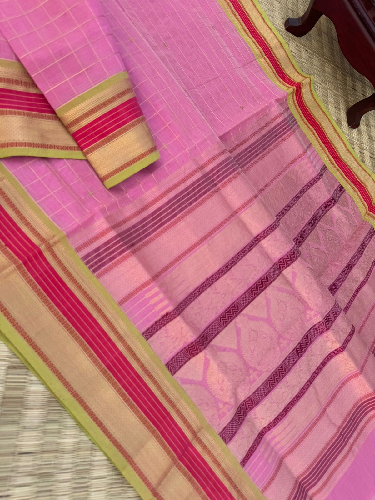 Pastels on Zari Kissed Silk Cotton - a stunning pastel baby pink with muthukattam and buttas woven together
