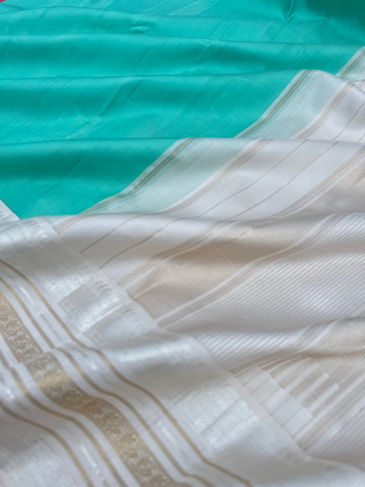 Diwali Edits - Soulful Kanchivaram - A pastel aqua green with silver and gold Zari Korvai ivory korvai borders