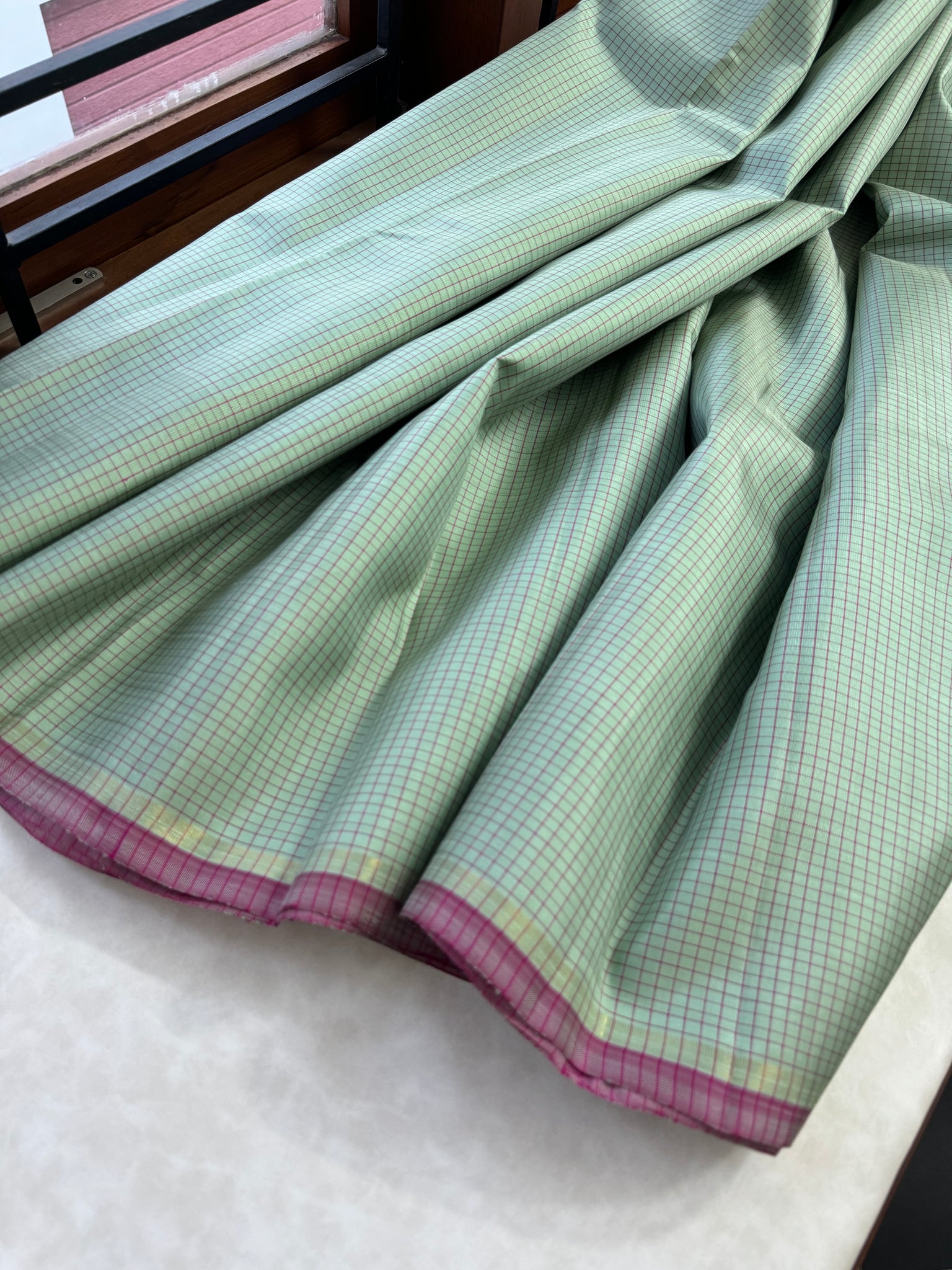 Adhyayam – The No Motifs Kanchivaram - a stunning pastel pista green podi kattam with rain pink pallu and blouse