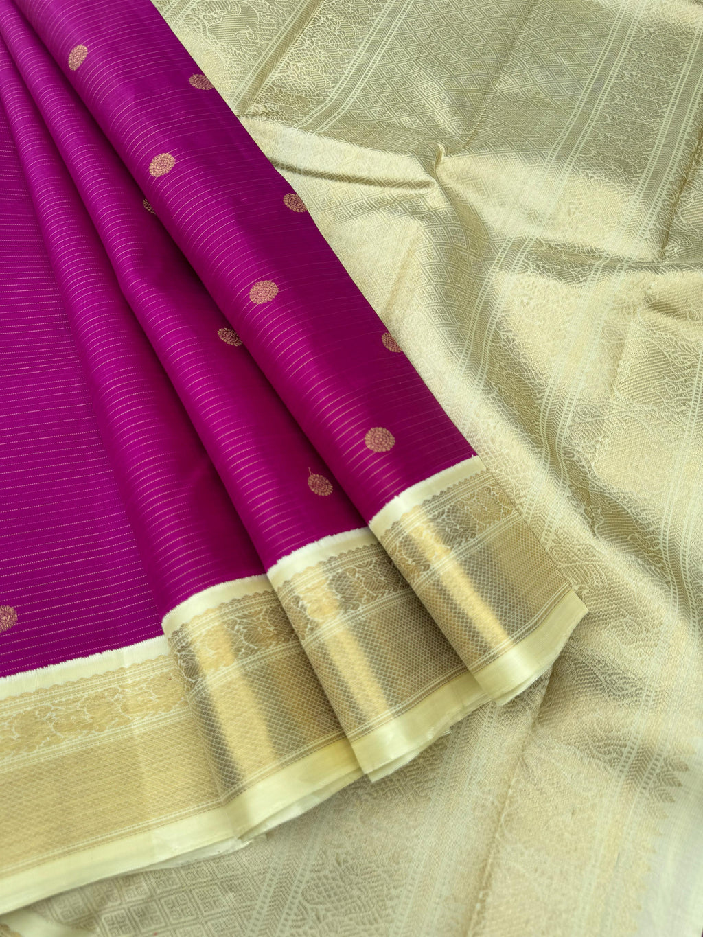Nila - The gorgeous off white/cream/venn pattu korvai border Kanchivarams - a gorgeous vaadamalli purple oosi stripes woven body