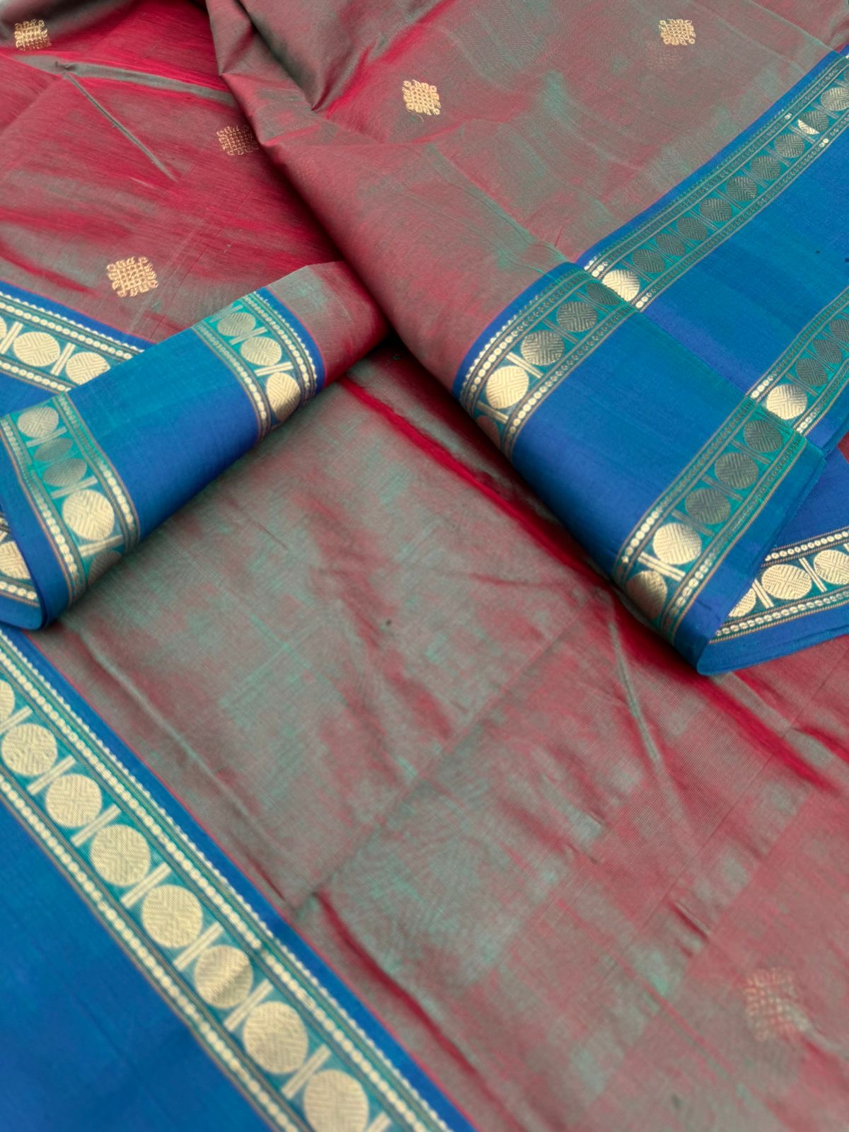 Zari Kissed Silk Cotton - maanthulir tone kolam buttas with peacock blue borders