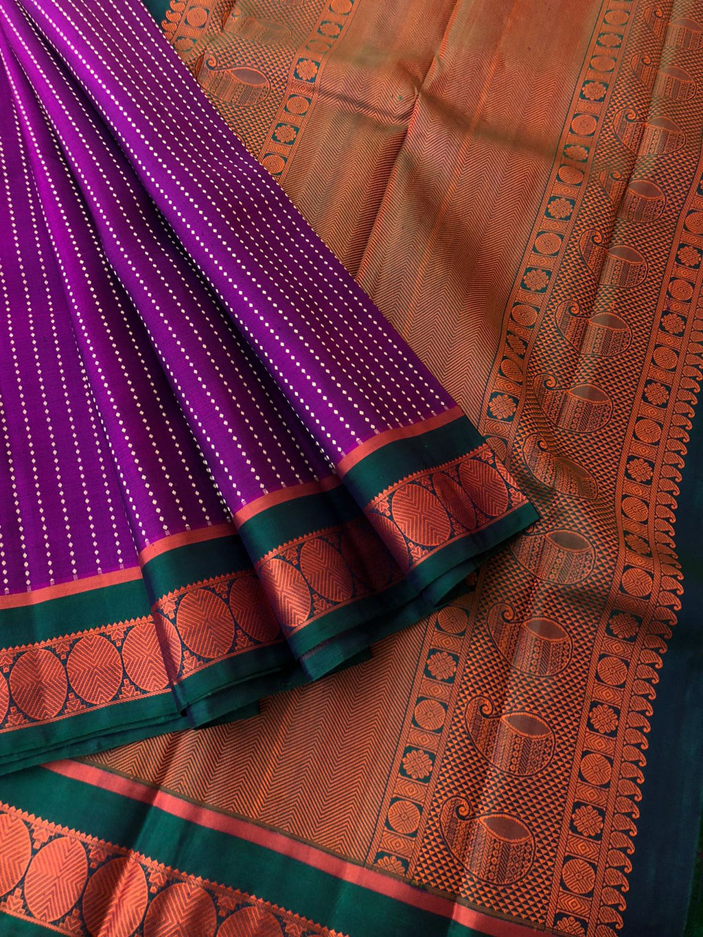Leela - Legacy Of Kanchivarams - amazing deep dark purple no zari Kanchivaram with copper tone silk thread woven motifs