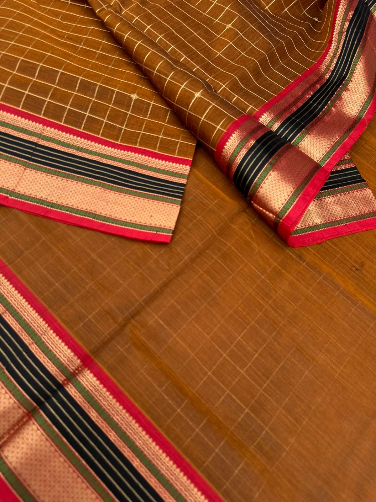 Zari Kissed Silk Cotton -burnt caramel brown muthu kattam is absolutely unusual