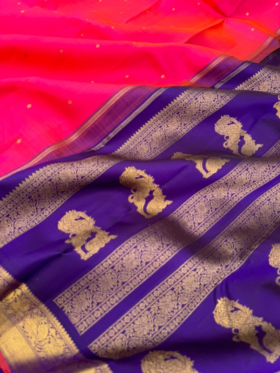 Aarambam - Where Tradition Begins - a beautiful kanakambaram pink mixed orange tone with deep ink violet yali woven pallu