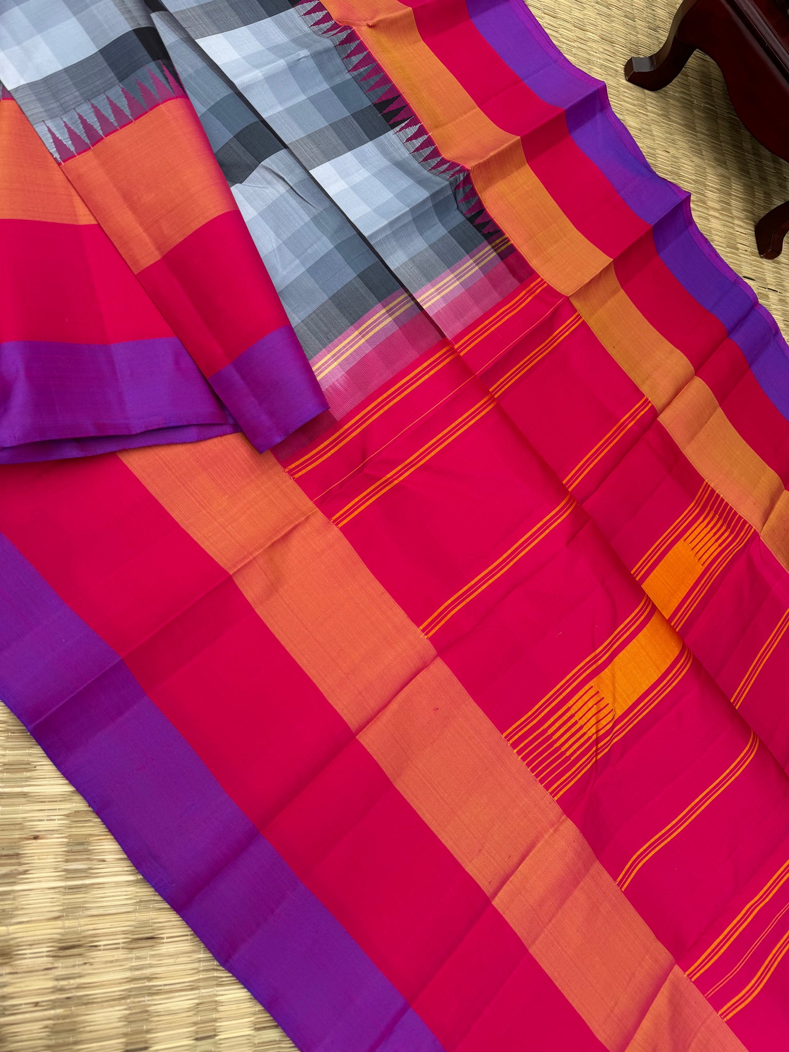 One of the most difficult Kanchivaram Silk - the weaver has to handle seven shuttles ( 5 for body and 2 for the borders ) digital grey black off white chex with three colour band woven borders
