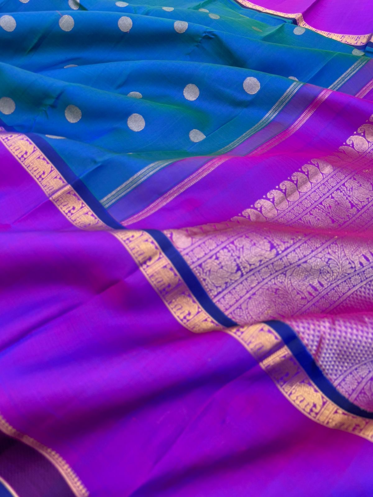 Colour Play on Kanchivaram - stunning peacock blue green dual tone body with violet tone broad woven borders