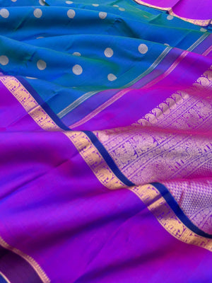 Colour Play on Kanchivaram - stunning peacock blue green dual tone body with violet tone broad woven borders