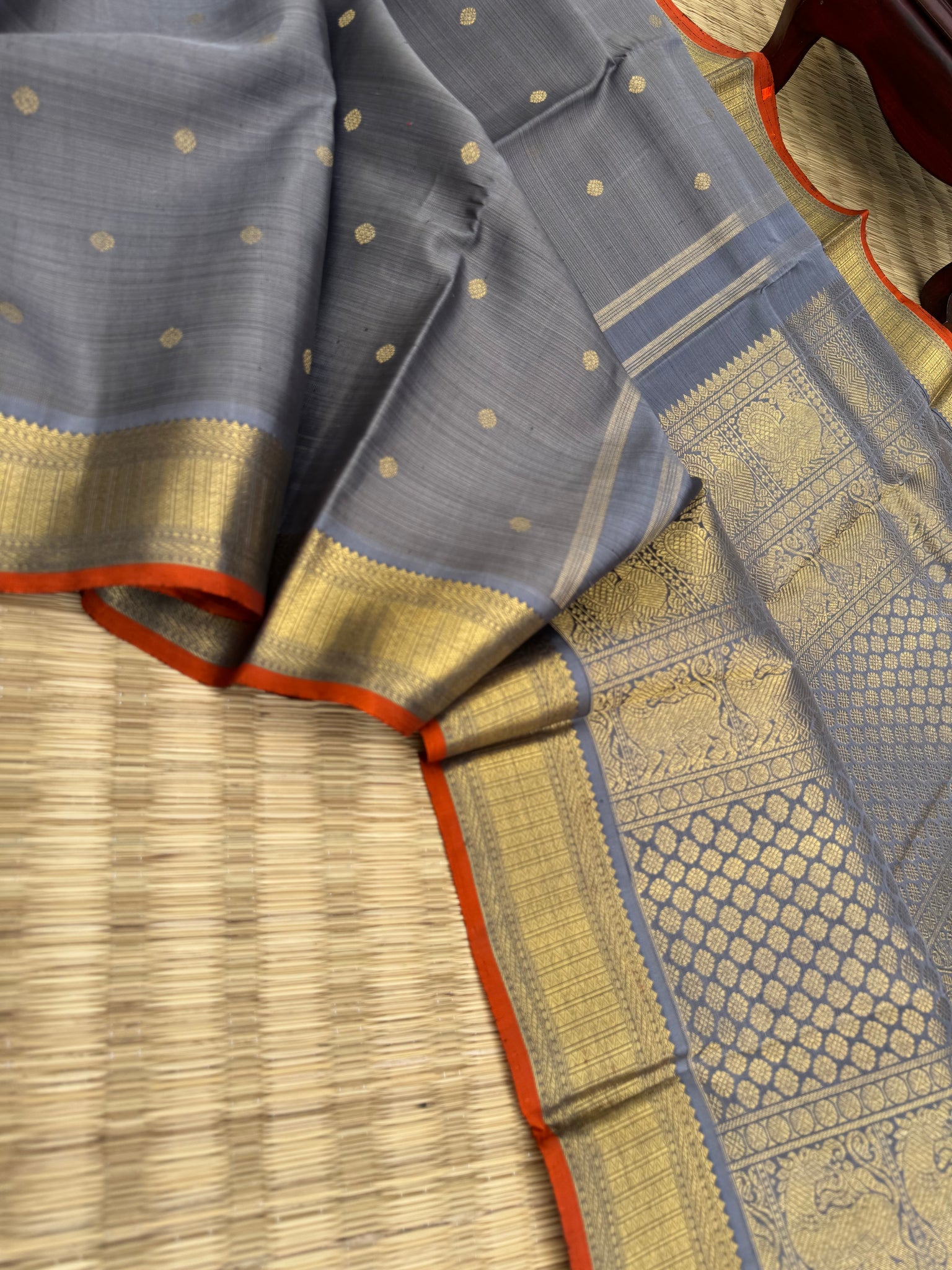 Molten Play on Kanchivaram - a stunning unusual molten Metallic grey vairaoosi the best part of the saree is the burnt orange sleeve edge