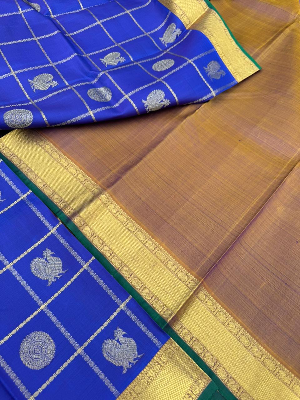 Colours of Navarathri 2025 on Kanchivarams - the traditional blue Mayil chackaram woven inside the veldhari kattam with intricate woven pallu