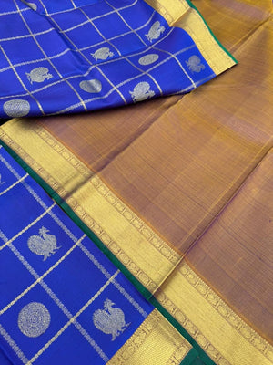 Colours of Navarathri 2025 on Kanchivarams - the traditional blue Mayil chackaram woven inside the veldhari kattam with intricate woven pallu