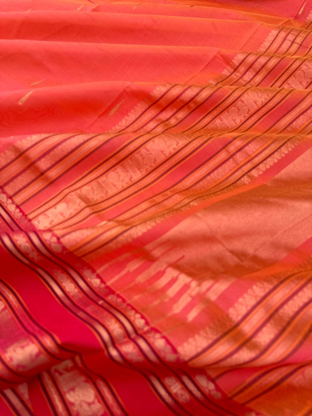 Zari Kissed Silk Cotton - a peach kanakambaram rain drop woven buttas