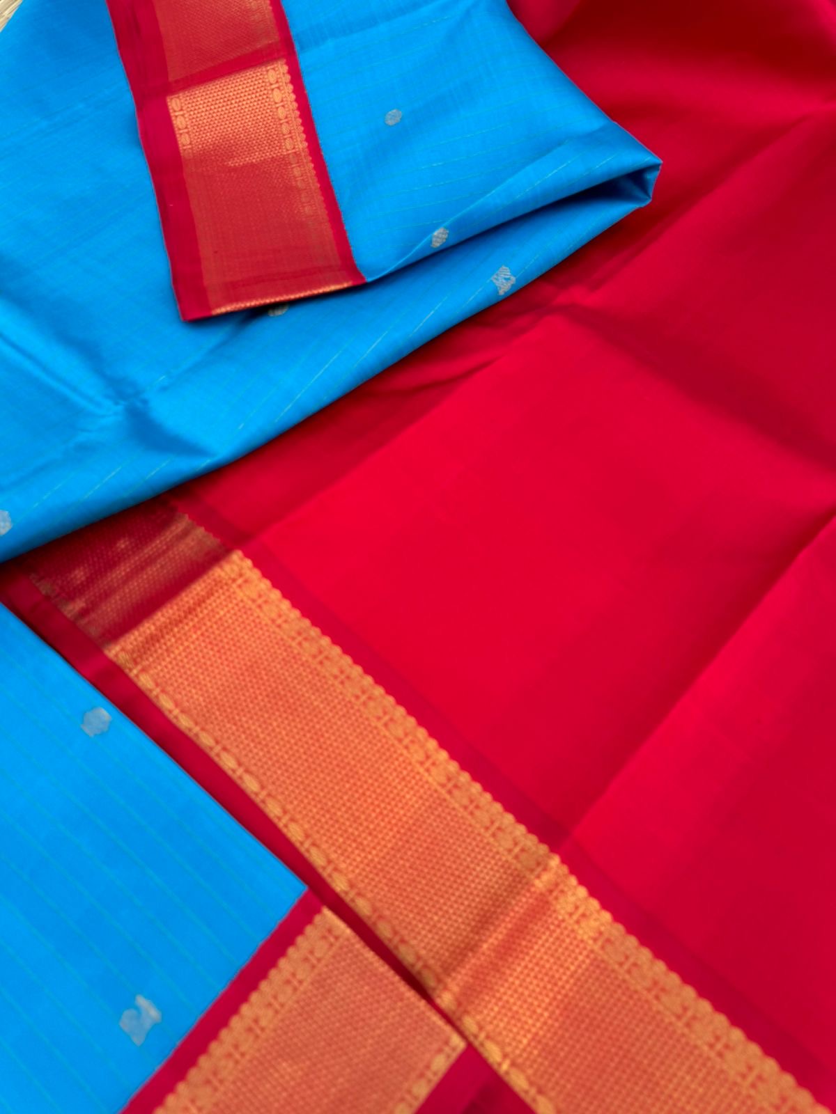Kanchivaram Trunk - gorgeous Anandha blue and red with vertical zari strips and buttas with aarai maadam woven borders