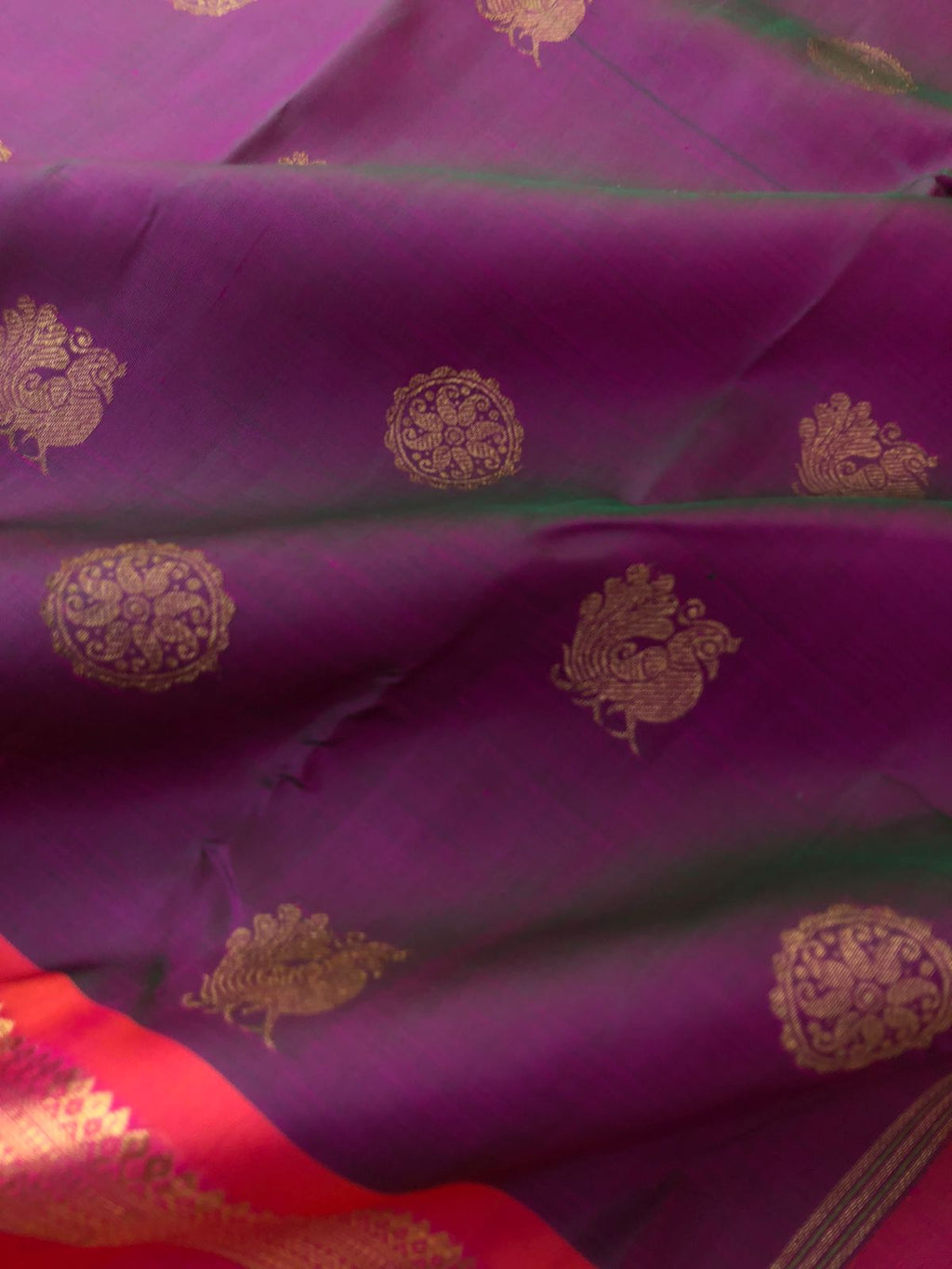 Leela - Legacy Of Kanchivarams - a perfect dual tone effects of purple short green with short pink broad woven borders