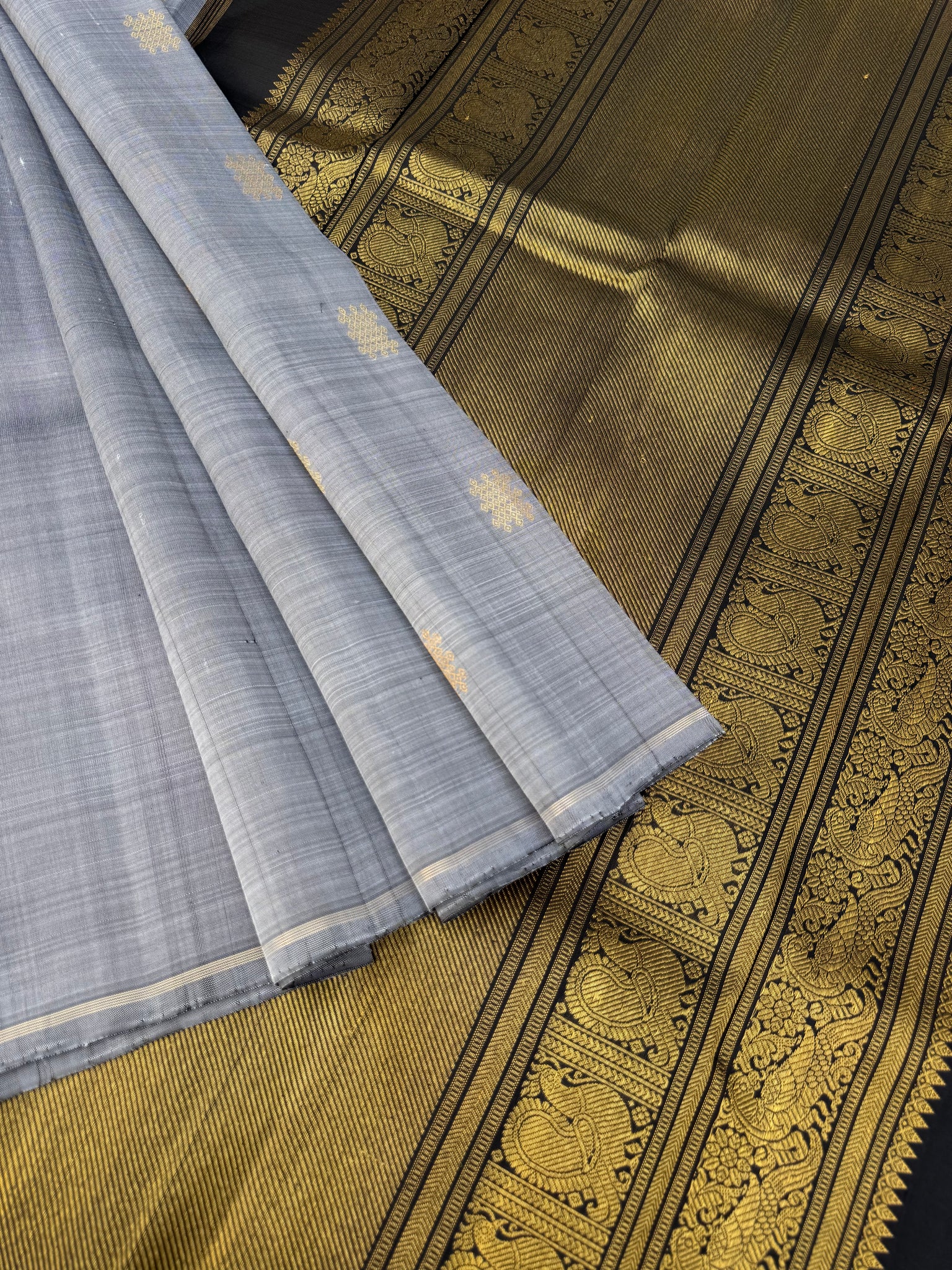 Mohaa - Beautiful Borderless Kanchivarams - stunning metallic grey and black with kolam buttas with grand woven pallu