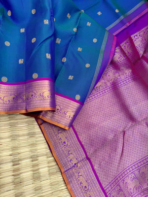 Valli - stunning peacock blue green with violet woven borders and pallu with traditional elephant woven borders