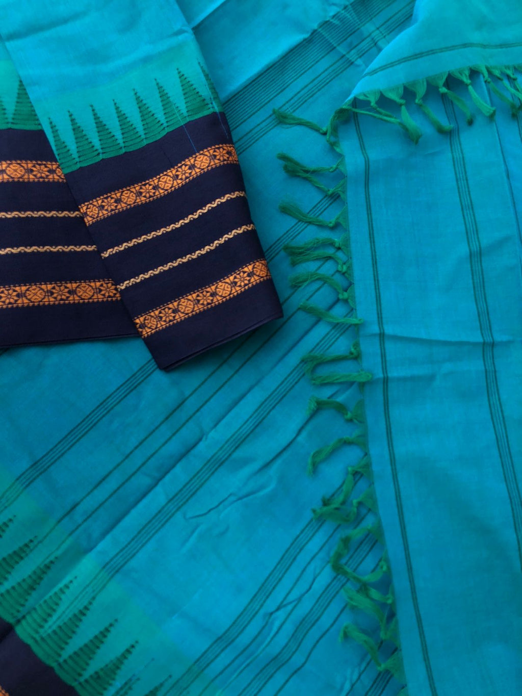 Korvai Stories - teal blue on navy blue