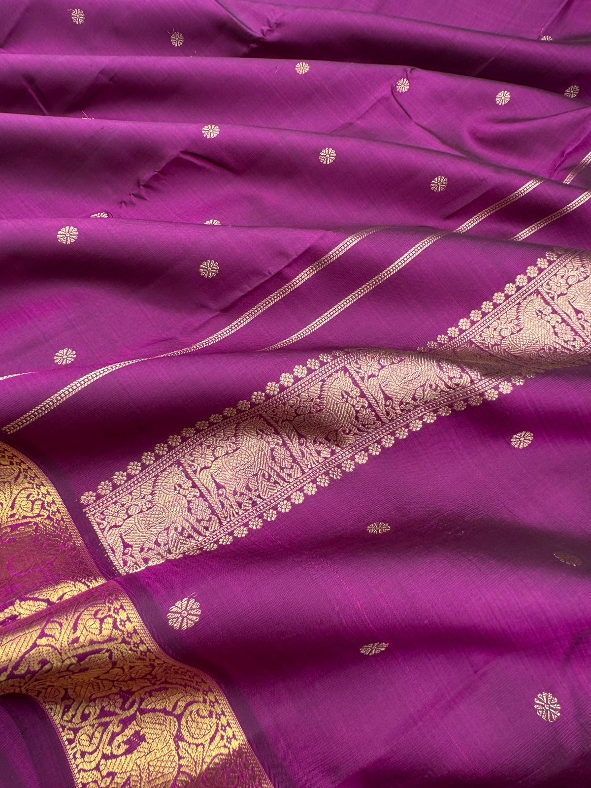 Parvathi - deep dark majentha purple with horse and elephants woven borders