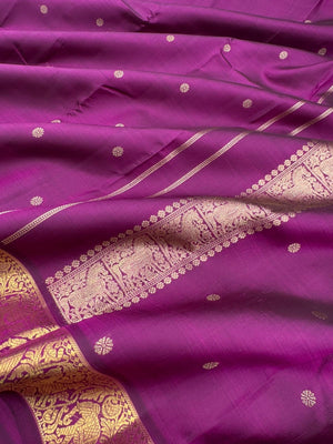 Parvathi - deep dark majentha purple with horse and elephants woven borders