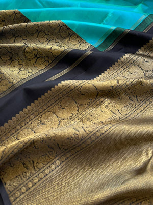 Tasteful Tall Border Kanchivarams - lovely dual tone blue and black with long zari woven one side korvai borders with grand pallu