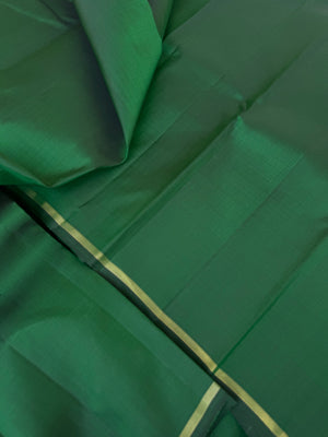 Contrast Play Kanchivarams - the full plain meenakshi green