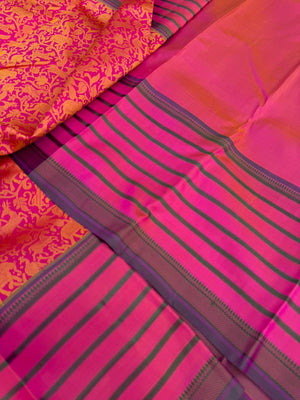 Vanasingaram on Kanchivaram - a pink base on motifs woven on mustard tone silk with varusai pett borders on no zari vanasingaram