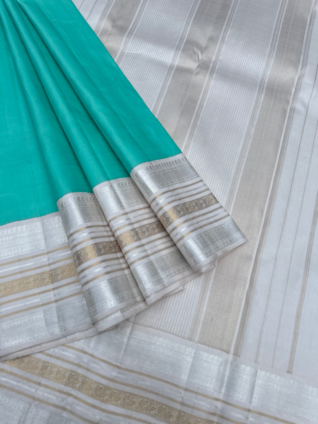 Diwali Edits - Soulful Kanchivaram - A pastel aqua green with silver and gold Zari Korvai ivory korvai borders