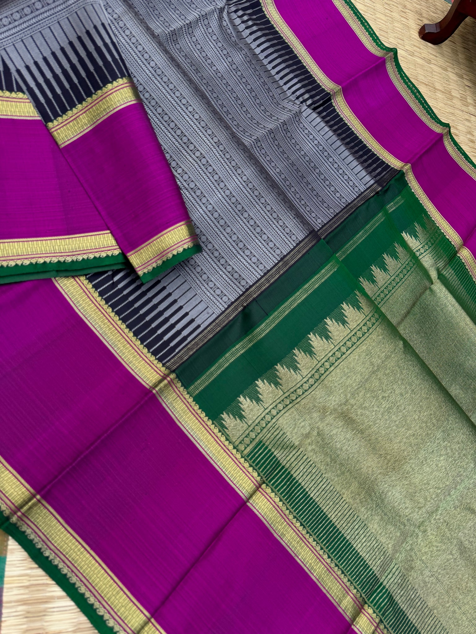 Haritham - Heirloom Yarn Play on Kanchivaram - a grey black full body varusai pett with green pallu and blouse with majentha borders