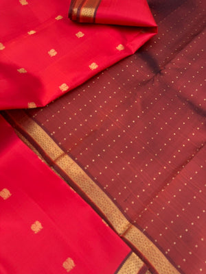 Leela - The bliss of small border Kanchivarams - brick red and maroon the best part of the saree is blouse has woven buttas