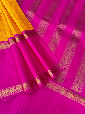Essence of Traditional Kanchivarams - a gorgeous vintage type broad borders mustard and sweet pink full body woven pluse buttas