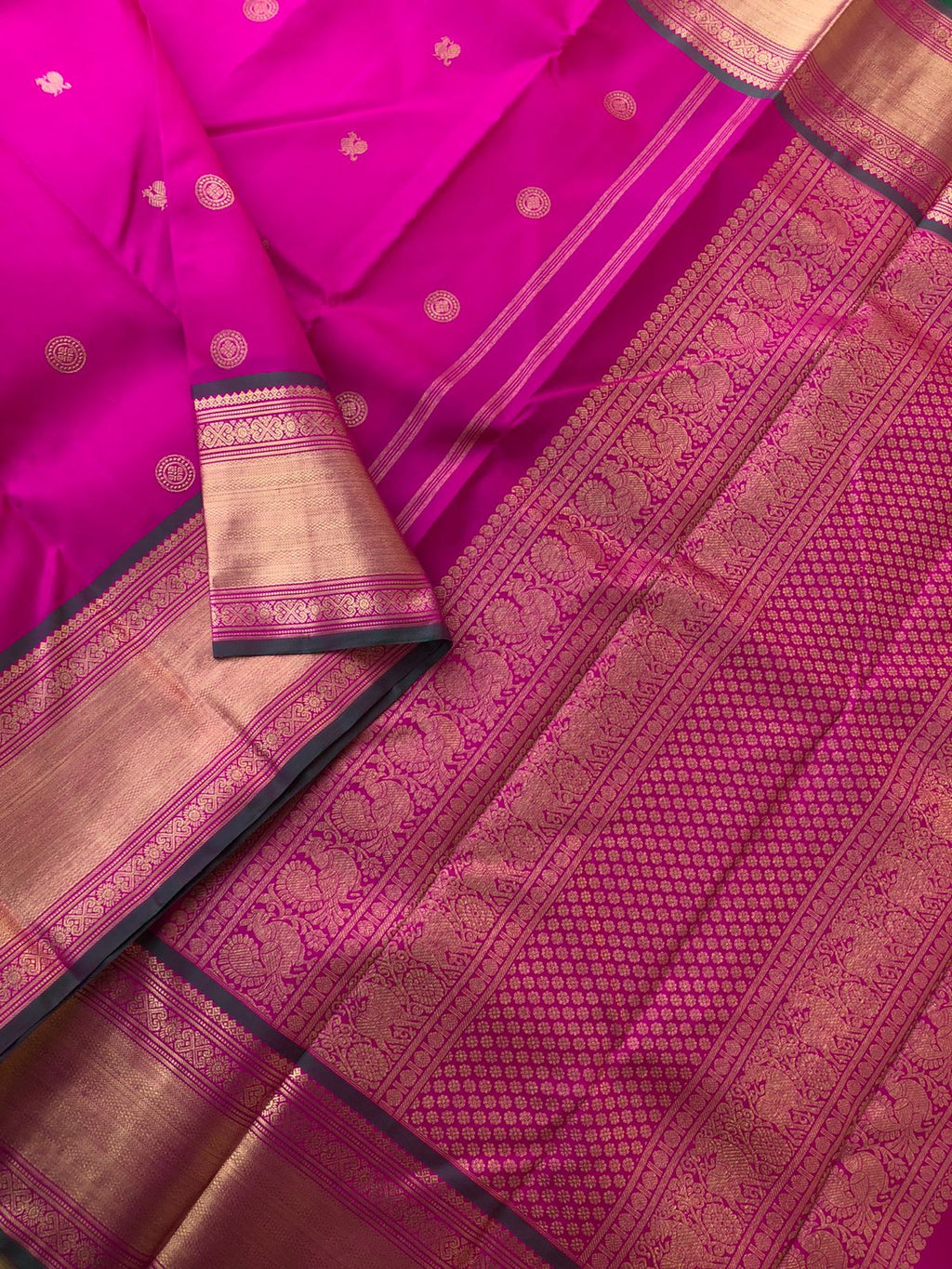 Leela - Legacy Of Kanchivarams - the traditional deep pink and solid gold Kanchivaram comes with Meenakshi green blouse