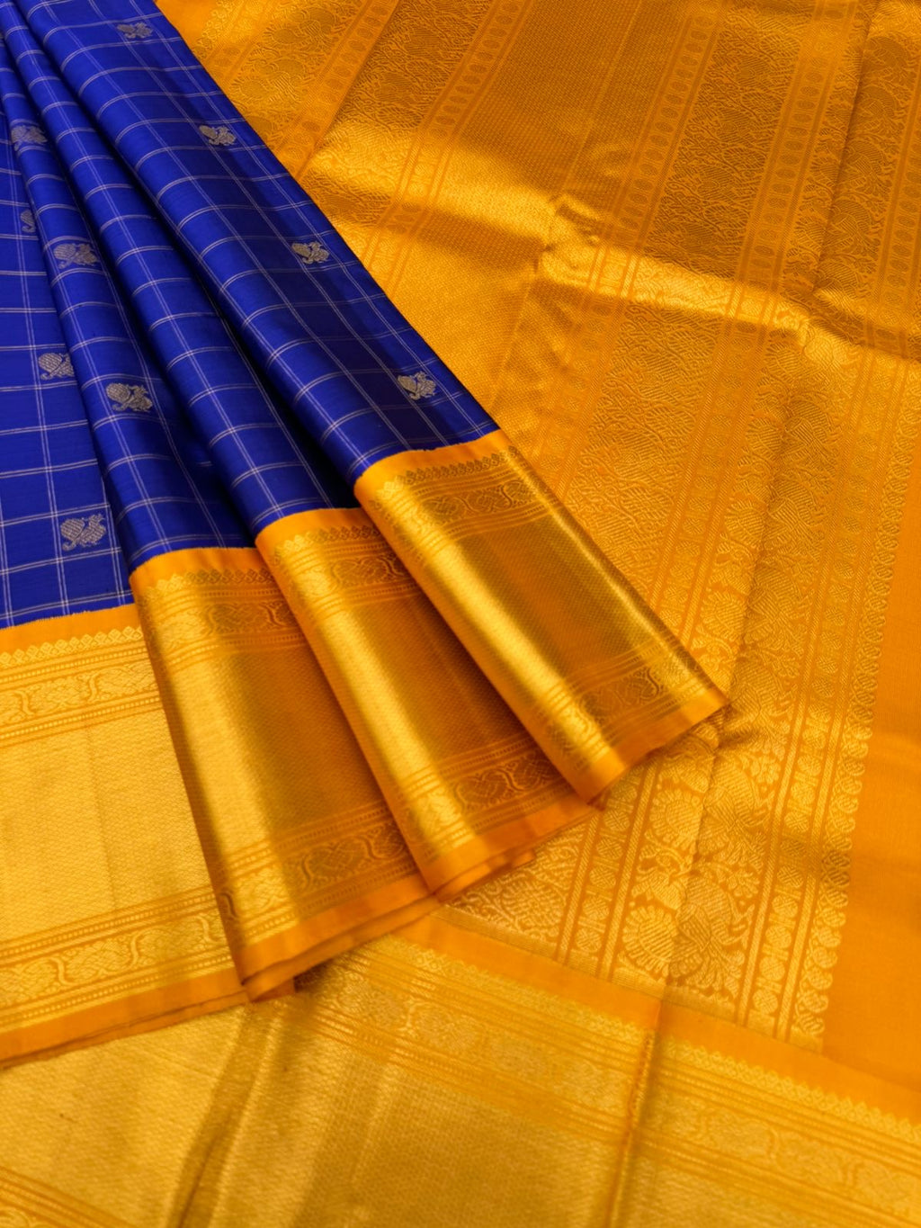 Colours of Navarathri 2025 on Kanchivaram - most grandest and most solid deep blue and golden mustard Korvai Kanchivaram with full gold zari woven broad borders with mayil chackaram woven buttas