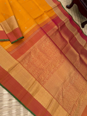 Colour Play on Kanchivaram - traditional at the best mustard and rust with aarai maadam woven borders with gorgeous grand pallu