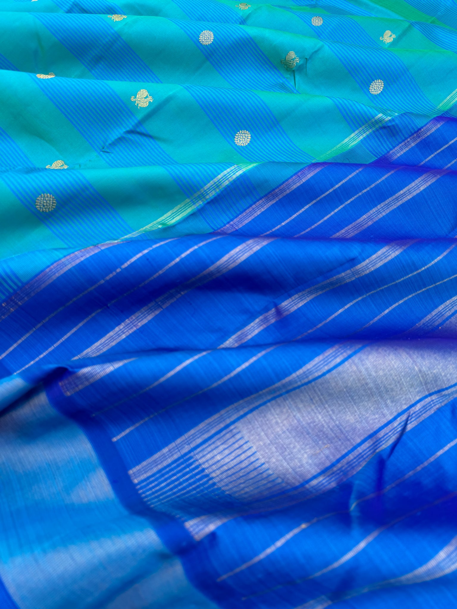 Album Untouched - a gorgeous teal and ananda blue body with mayil chackaram woven buttas