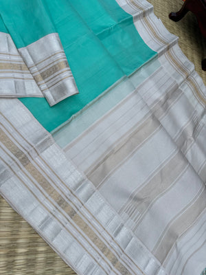 Diwali Edits - Soulful Kanchivaram - A pastel aqua green with silver and gold Zari Korvai ivory korvai borders