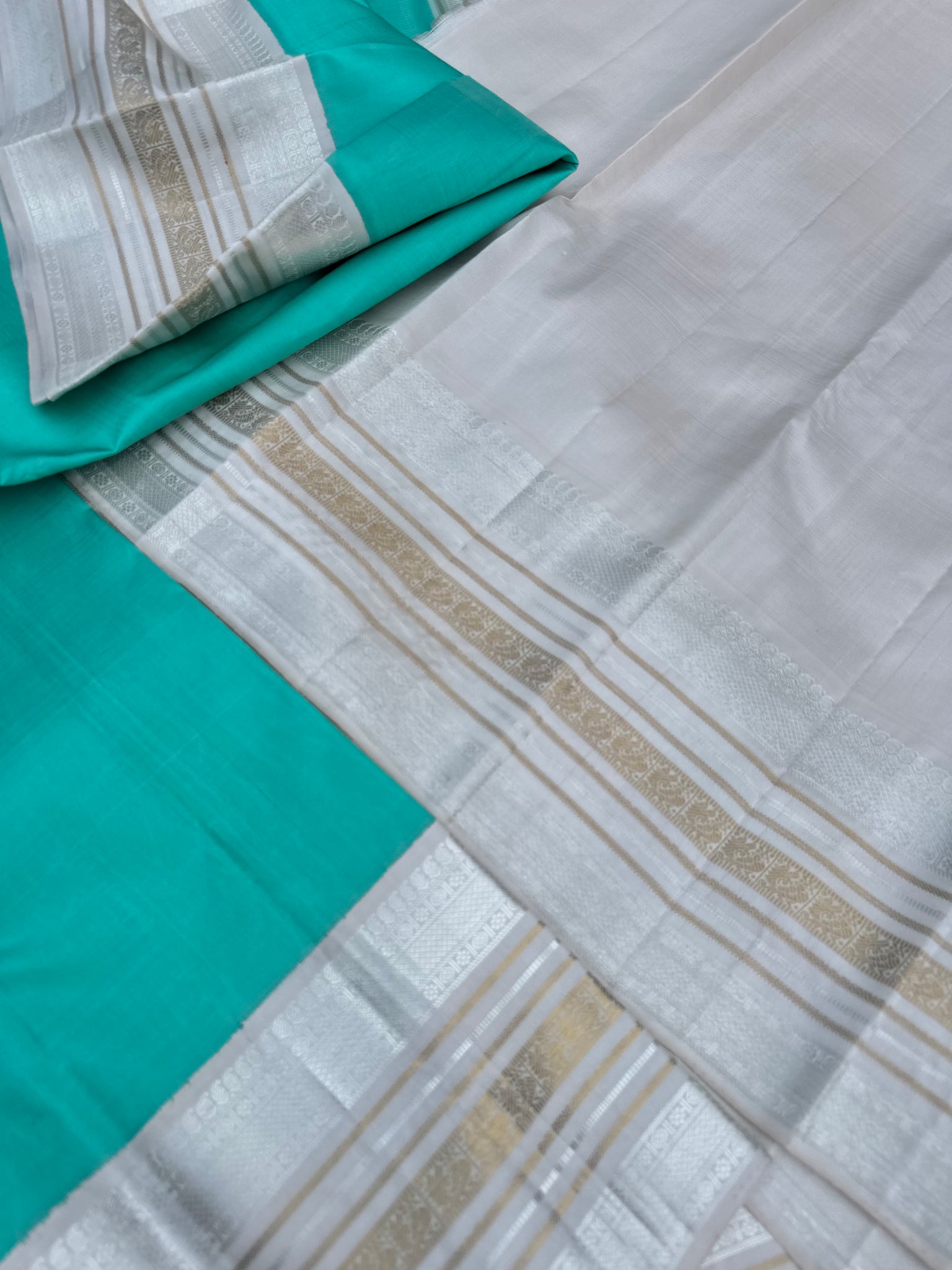 Diwali Edits - Soulful Kanchivaram - A pastel aqua green with silver and gold Zari Korvai ivory korvai borders