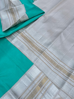 Diwali Edits - Soulful Kanchivaram - A pastel aqua green with silver and gold Zari Korvai ivory korvai borders